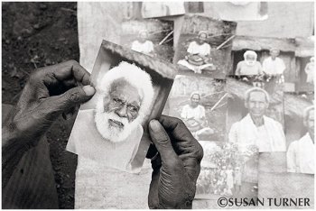 Ungaro Looking at a Photo of Himself