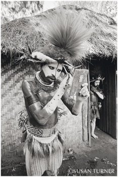 A Young Huli Getting Ready to Perform for Tourists