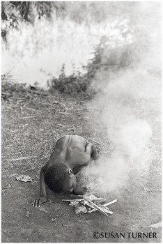 A Small Girl Making a Small Fire